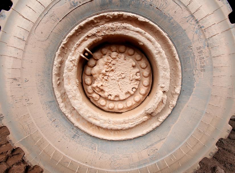 Truck wheel covered in clay